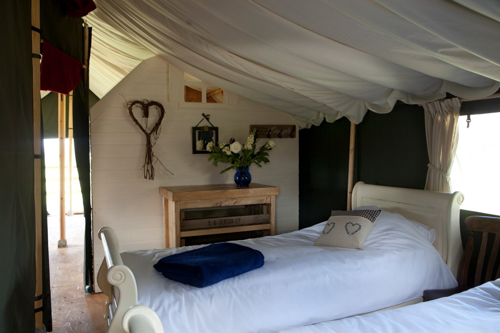 Master bedroom with sleigh bed & luxury linens