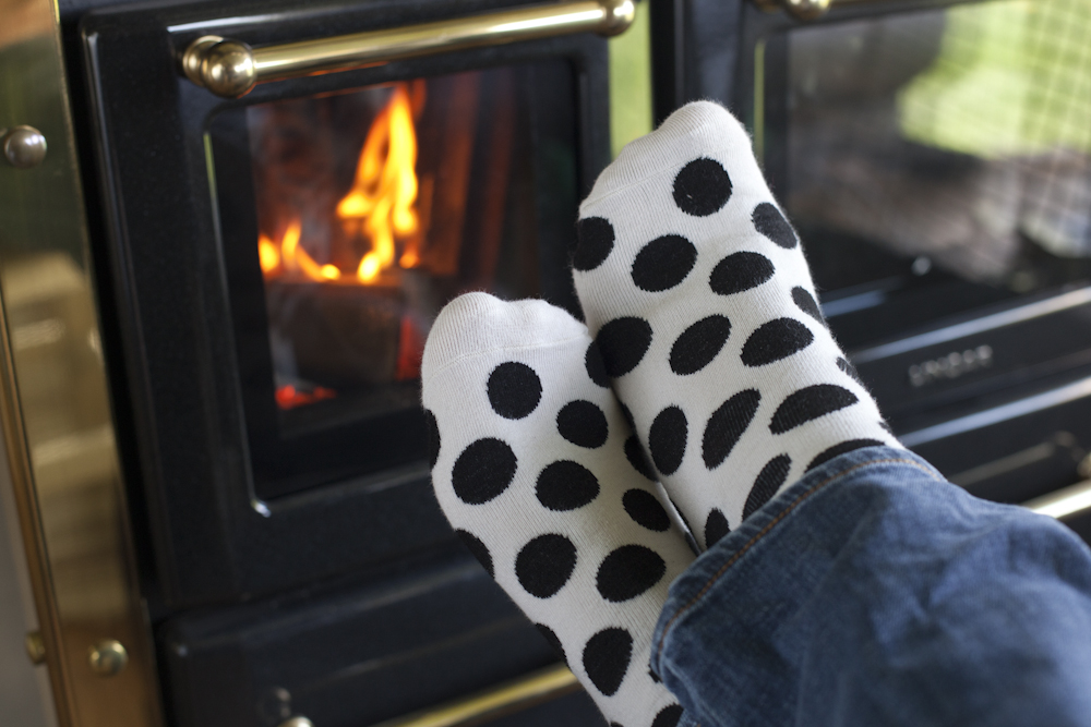 Warming up by the wood-burning stove