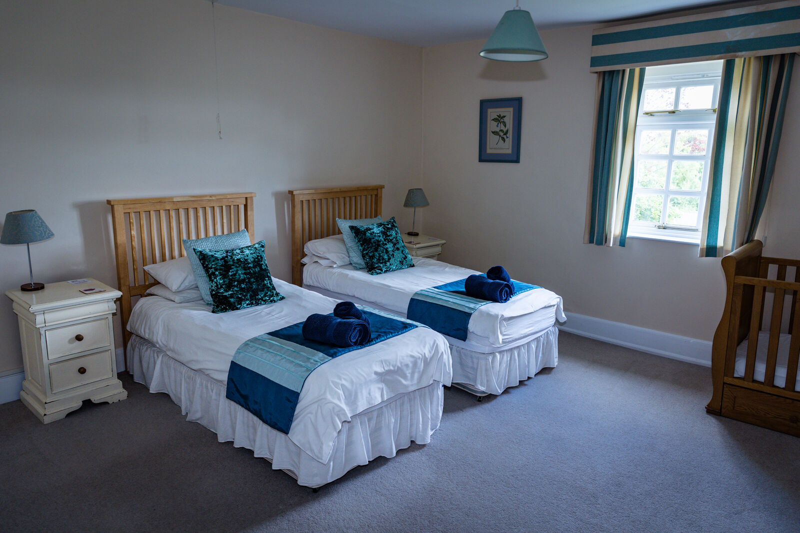 Spacious twin bedroom in calming coastal blues