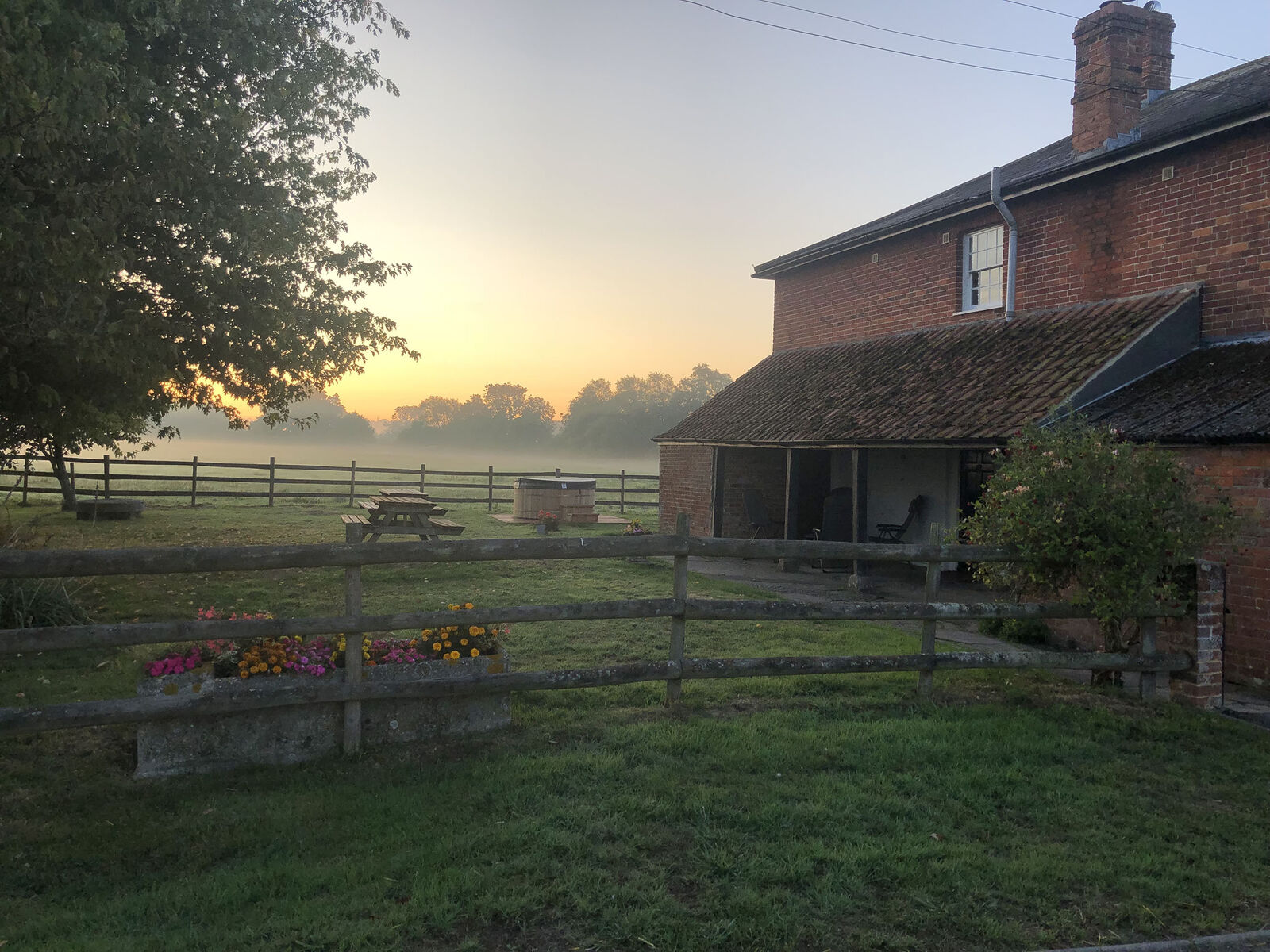 Mill Farm House at dawn — mist rolling across the fields