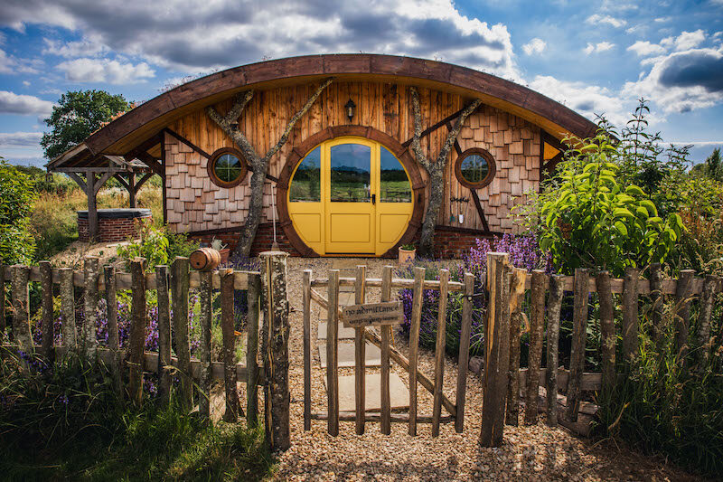 The iconic yellow round door — straight out of the Shire