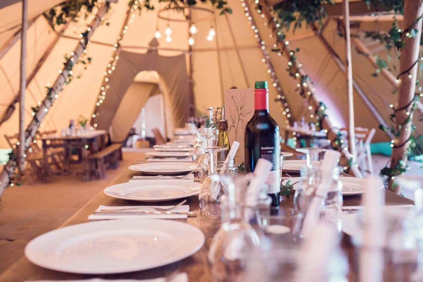Fairy-lit tipi dining