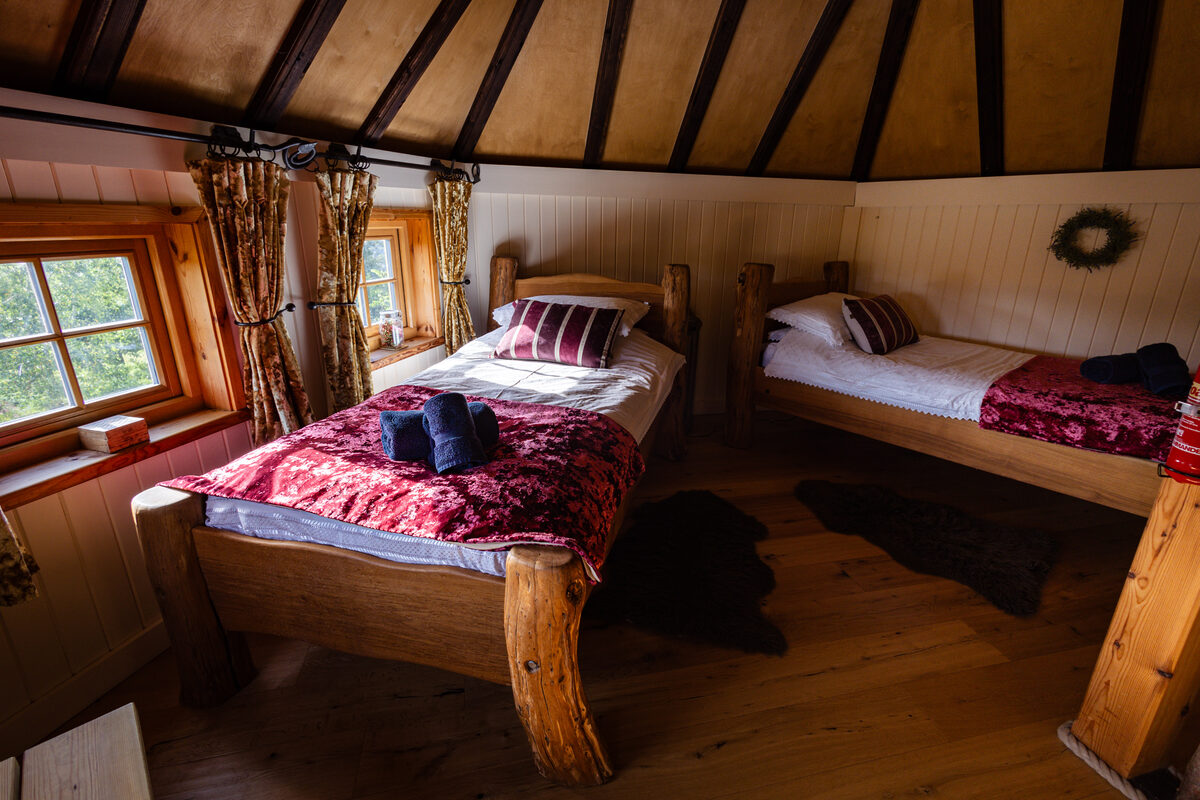 Twin room with handcrafted log beds